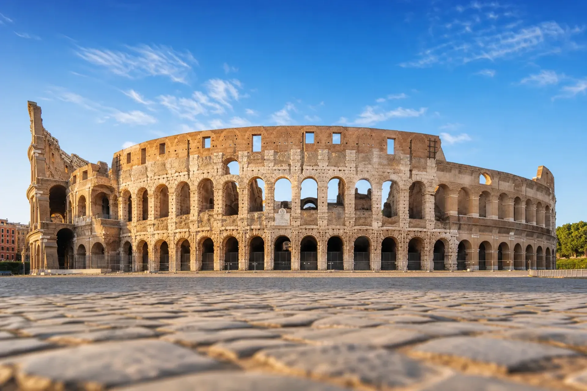 Greece, Italy & Malta-A sun-drenched view of the Colosseum in Rome, a highlight of our Greece Italy Malta tour.