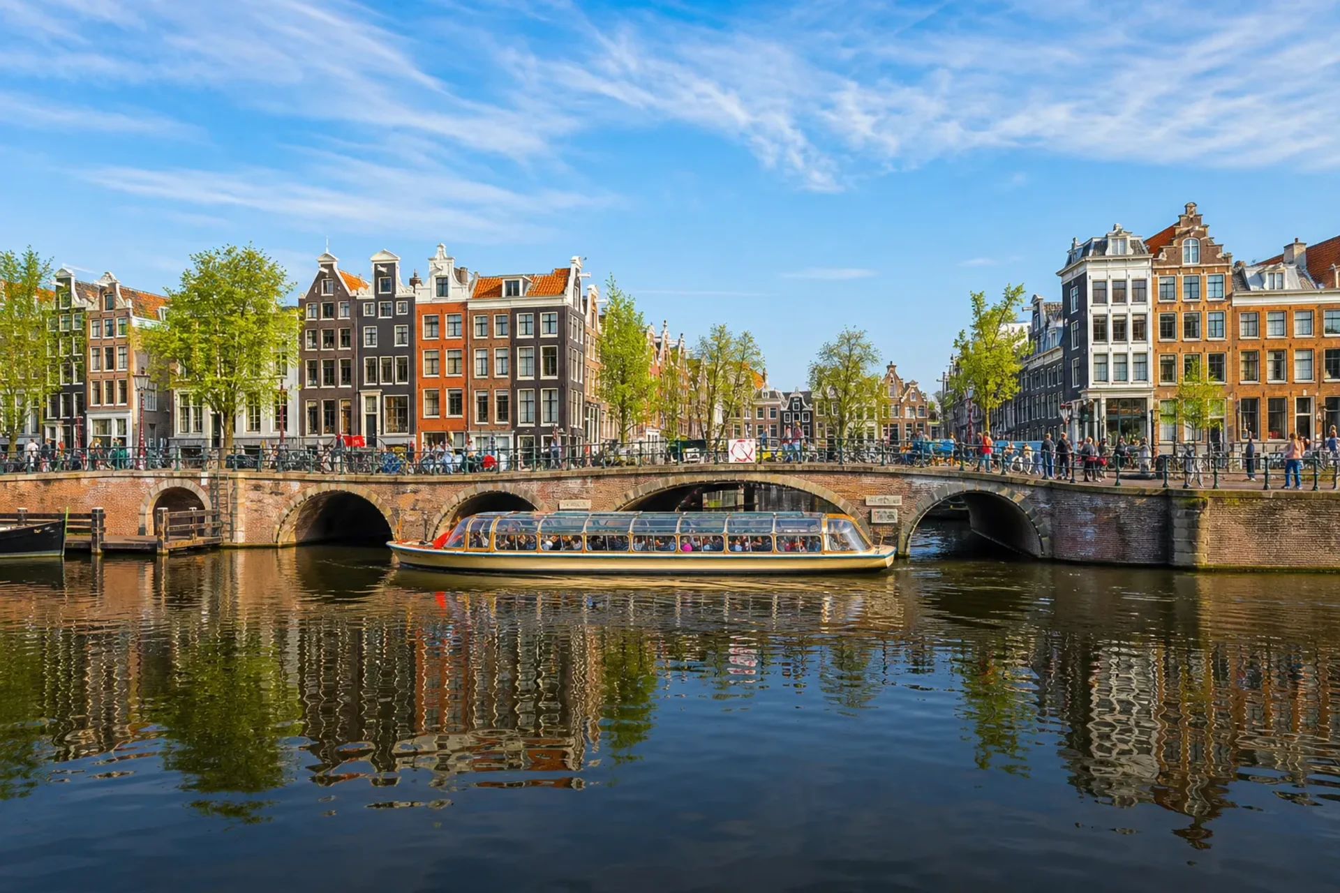 Netherlands-A sunlit view of the Amsterdam canals, a key highlight of the Viva river waterways north cruise.